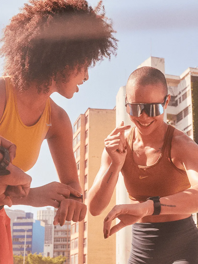Two athletes training together in the sun